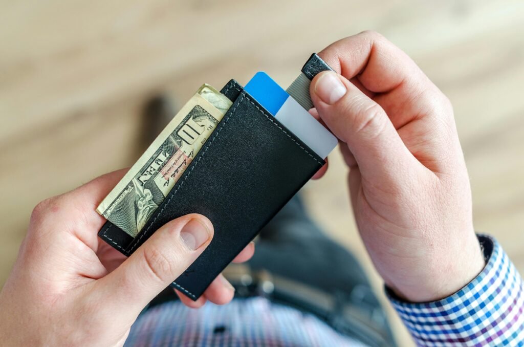 a man savings money in wallet