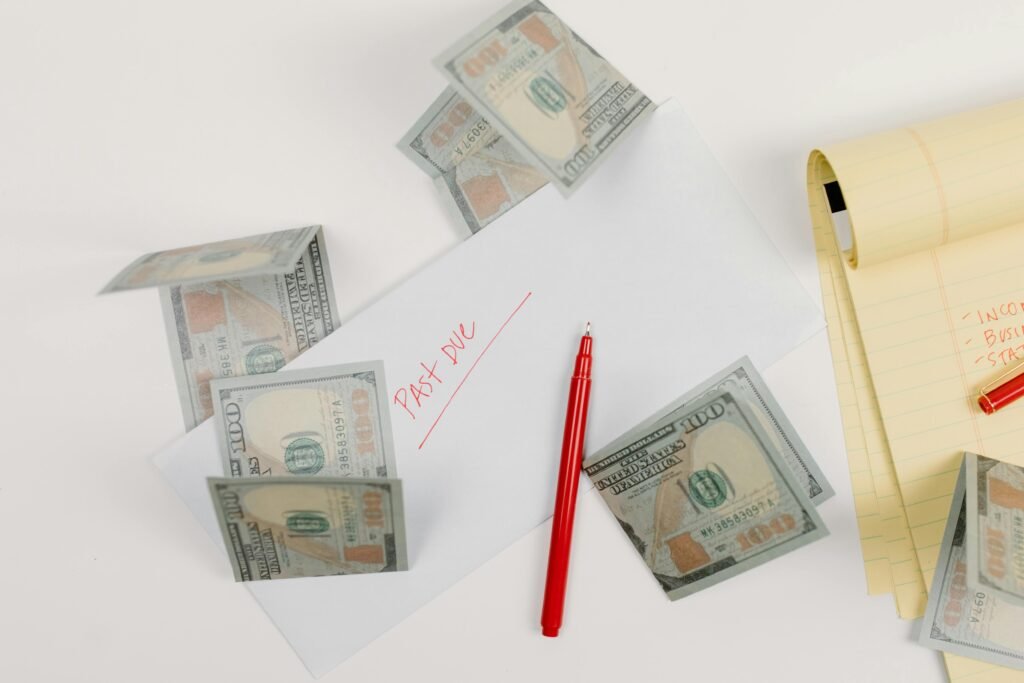 pen and paper with money on the desk